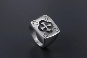 Detail of silver vintage signet ring featuring a textured cross and matte finish