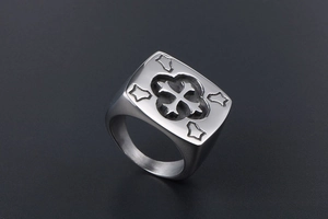 Macro detail of men's titanium steel ring with gothic cross relief and vintage silver finish