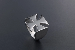 Detailed close-up of matte silver cross ring with cross pattée design and thick band