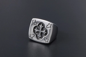 Macro view of retro stainless steel signet ring with embossed cross design and brushed finish