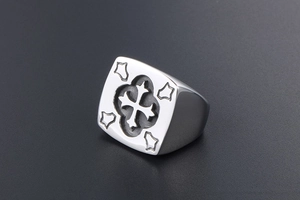 Close-up of vintage titanium steel square signet ring with engraved cross design