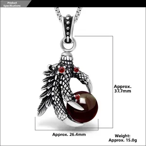Gothic dragon claw pendant with black bead and red gems, showing dimensions 37.7mm x 26.4mm
