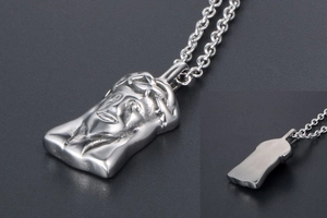Detail of Jesus head relief pendant in silver steel with polished and matte finish