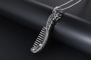 Macro view of Chinese style dragon comb pendant made of titanium steel with detailed scales