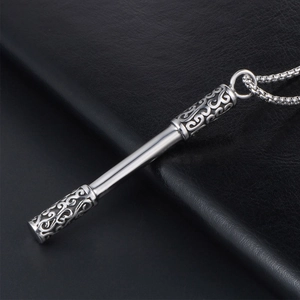 Silver Ruyi Jingu Bang necklace with hollow cloud patterns on black leather background