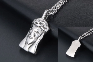 Macro view of silver titanium steel Jesus pendant with detailed crown of thorns