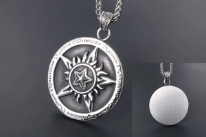 Detailed macro view of vintage star pendant with radial solar patterns and runes
