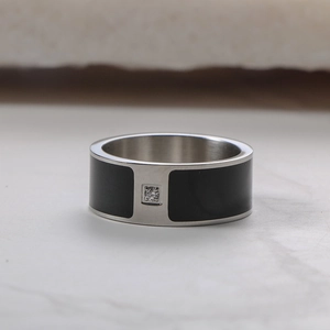 Minimalist titanium steel couple ring with black inlay and small center diamond