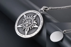 Detailed close-up of vintage pentagram pendant with flame relief and brushed metal back