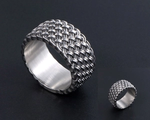 Macro shot of men's vintage woven texture titanium steel ring with polished inner surface