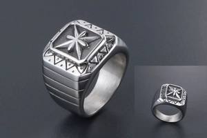 Macro shot of vintage silver square ring featuring a central embossed star motif