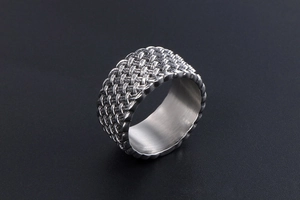 Detail of wide woven texture on a vintage silver steel ring for men and women