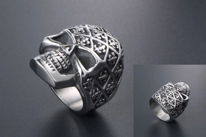 Macro detail of skull ring with diamond lattice texture and fleur-de-lis engraving