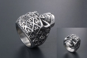 Detailed relief of punk skull ring with gothic fleur-de-lis and vintage silver finish