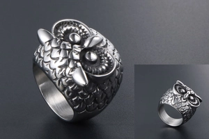 Macro detail of gothic owl ring showing realistic feather texture and punk metal style