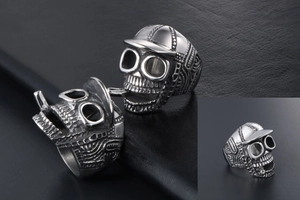 Detailed view of vintage skull ring with hat and glasses in polished stainless steel