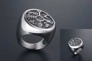 Macro shot of Viking Vegvisir symbol engraved on a retro stainless steel signet ring