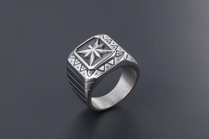 Macro view of vintage punk ring featuring a square face and 3D engraved star