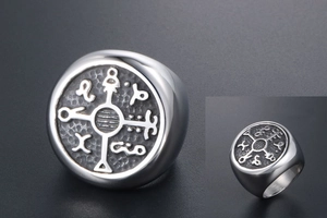 Detailed view of men's retro titanium ring featuring carved mystic astrological symbols