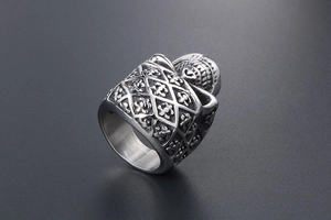 Macro shot of gothic style stainless steel ring with intricate floral engraving details