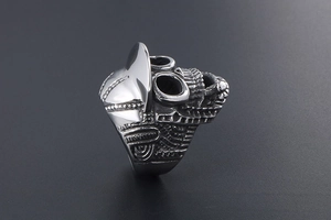 Detailed view of vintage punk skull ring with intricate mechanical and tribal engravings
