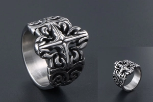 Macro view of gothic titanium steel ring featuring ornate cross and filigree patterns