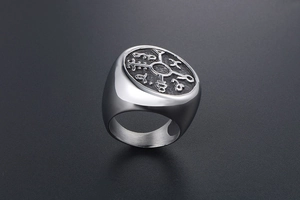 Detail of vintage Nordic rune signet ring in titanium steel with retro black finish