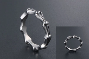 Detail view of gothic style silver titanium steel ring with antique finish and bone joint design