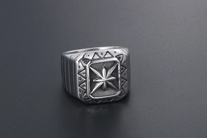 Macro view of vintage punk ring with compass star pattern and anti-slip textures