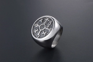 Macro detail of vintage men's titanium steel signet ring with engraved nordic rune symbol