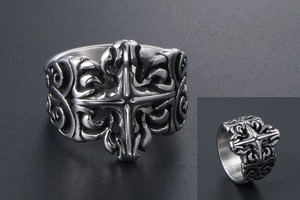 Macro detail of gothic stainless steel ring featuring vintage cross and scroll engravings