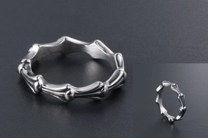 Macro detail of gothic bone pattern titanium steel ring with punk style texture