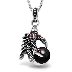 Retro dragon claw pendant necklace with red crystals and large black bead on silver chain