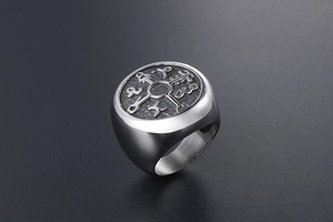 Detailed view of silver titanium steel ring with mystical runes and matte finish