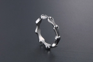 Macro shot of vintage gothic bone structure ring in polished silver stainless steel