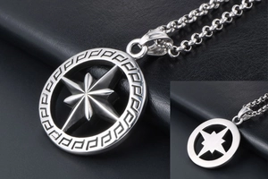 Macro shot of silver hollow octagonal star pendant with greek fret pattern detail