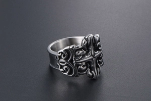 Detailed close-up of retro titanium steel ring featuring gothic cross and floral engravings