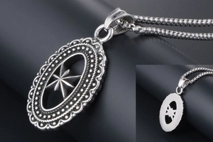 Detailed close-up of hollow oval eight-pointed star pendant with beaded edge and bead chain
