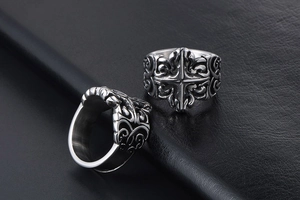 Detailed relief of vintage gothic cross patterns on wide silver titanium steel rings