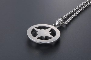 Macro shot of silver titanium steel necklace featuring a hollow octagonal star pendant