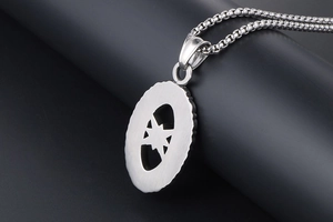 Macro shot of silver octagonal star hollow pendant on a textured box chain necklace