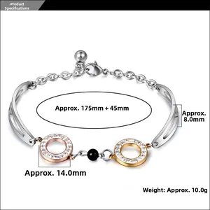Detail of rose gold and silver rings with black beads on a titanium steel bracelet