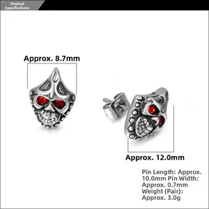 Detailed view of silver skull earrings with red crystal eyes and physical size dimensions