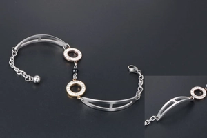 Close-up of rose gold pave circles and black obsidian beads on a multi-strand bracelet