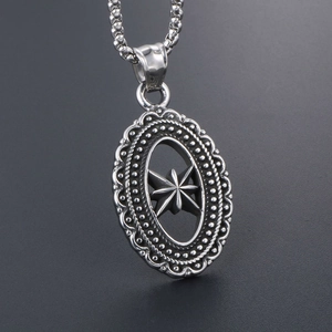 Vintage stainless steel oval pendant necklace featuring a hollowed octagonal star design