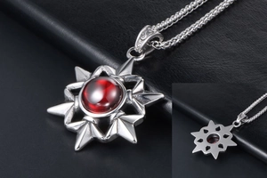Macro view of vintage titanium steel necklace with a red gemstone in star pendant