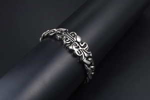 Close-up of vintage gothic cuban link bracelet in oxidized silver-tone stainless steel