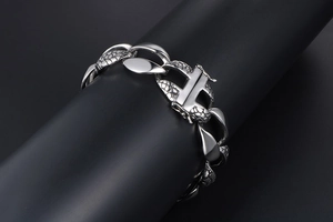 Detailed view of silver snake skin texture links and square box clasp on punk metal bracelet