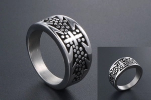 Detailed macro view of the vintage titanium steel cross ring with dotted relief texture