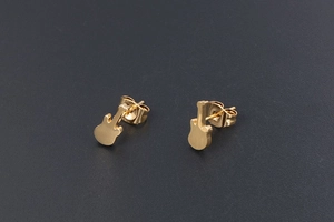 Detailed view of 24K gold plated titanium steel guitar stud earrings on dark background
